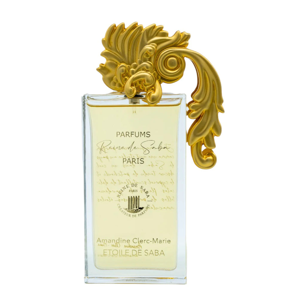 ÉTOILE DE SABA perfume bottle by Novo Perfumes, elegant glass container with gold accents and a sleek design.