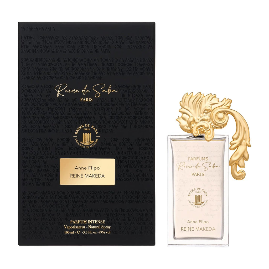 Reine Makeda perfume by Novo Perfumes, elegant bottle with floral and woody notes, displayed on a sleek surface.